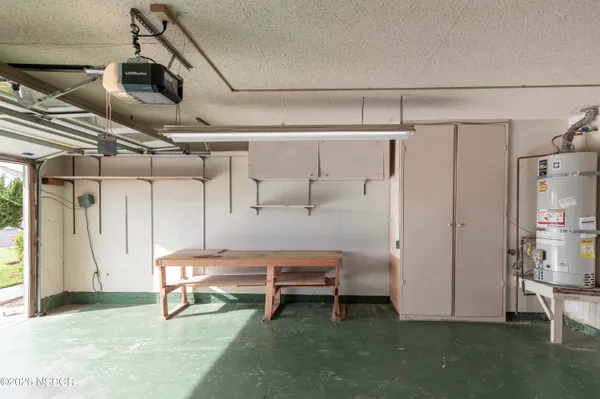 a bathroom with a sink a toilet and a shower