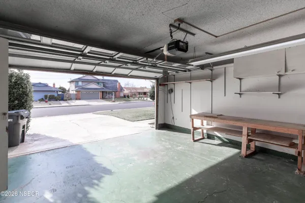 a view of an empty room with a garage