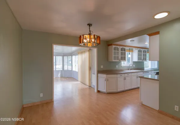 a kitchen with granite countertop a stove and a sink