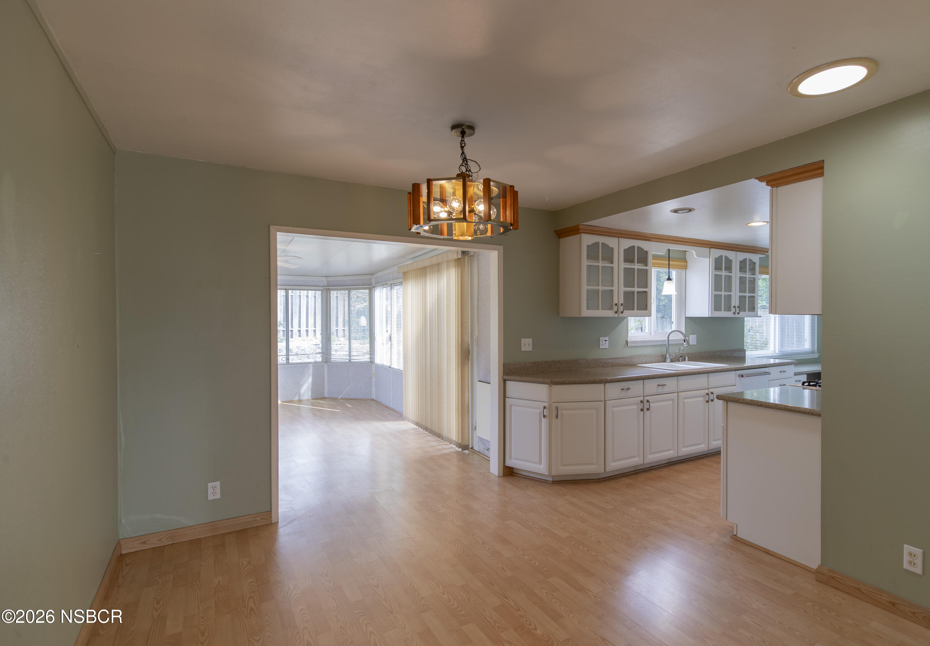 124 Princeton Place Lompoc, CA 93436 - Photo 7 of 41 a kitchen with granite countertop a stove and a sink