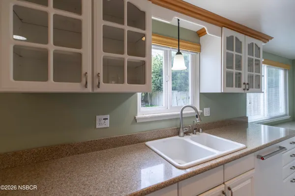 a bathroom with a sink and a window