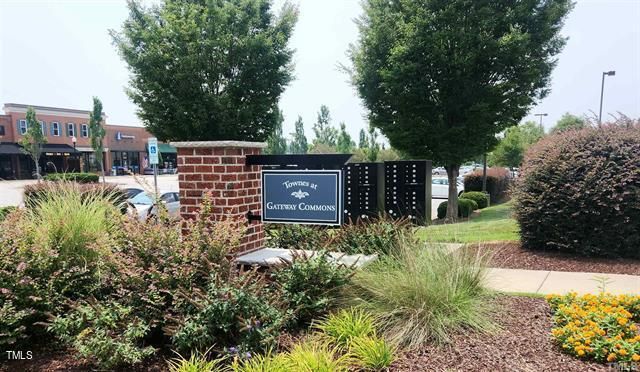a view of a house with a yard and garden