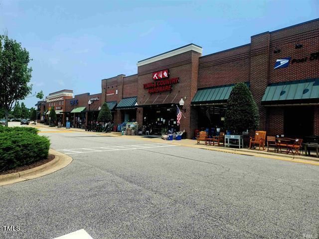 a view of street with parked on the roadside