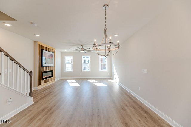 a view of a big room with wooden floor windows and stair