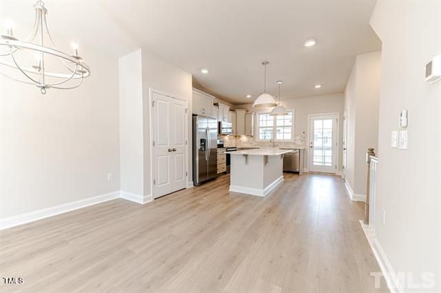 a view of kitchen with wooden floor