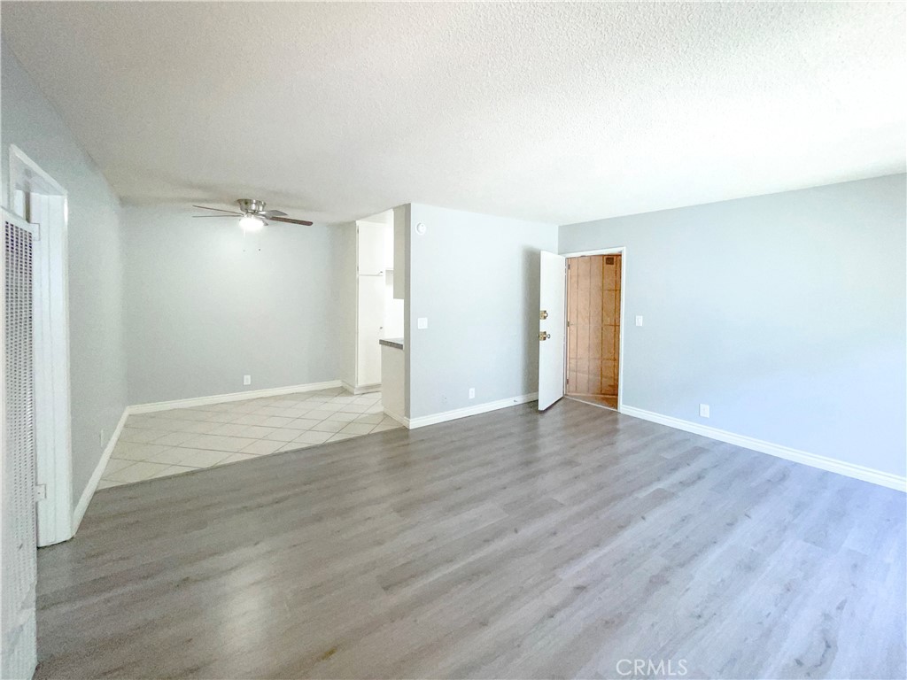 13717 Chadron Avenue, Unit 26 Hawthorne, CA 90250 - Photo 5 of 12 a view of an empty room with wooden floor