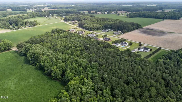 an aerial view of a houses with outdoor space and street view