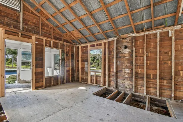 a view of an empty room with windows