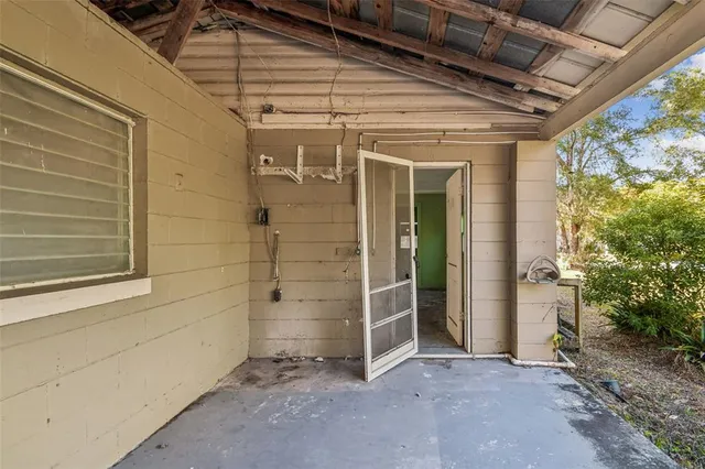 a view of a big room next to a yard