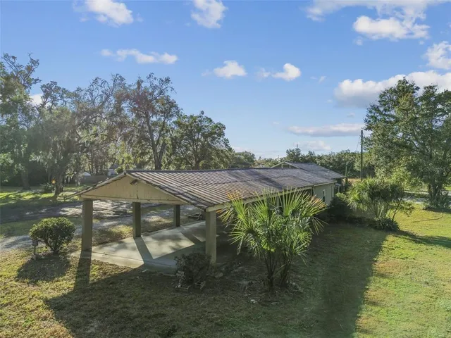 a view of yard along with trees