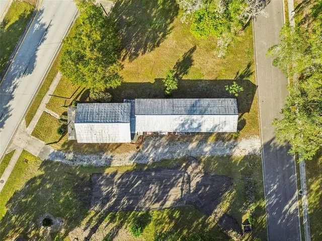 a brick building with a tree