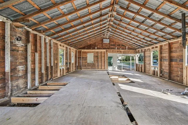 a view of pool with wooden stairs