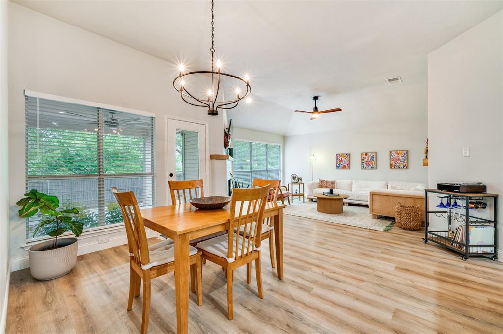7306 Vista Ridge Lane Sachse, TX 75048 - Photo 8 of 23 a view of a dining room with furniture window and wooden floor