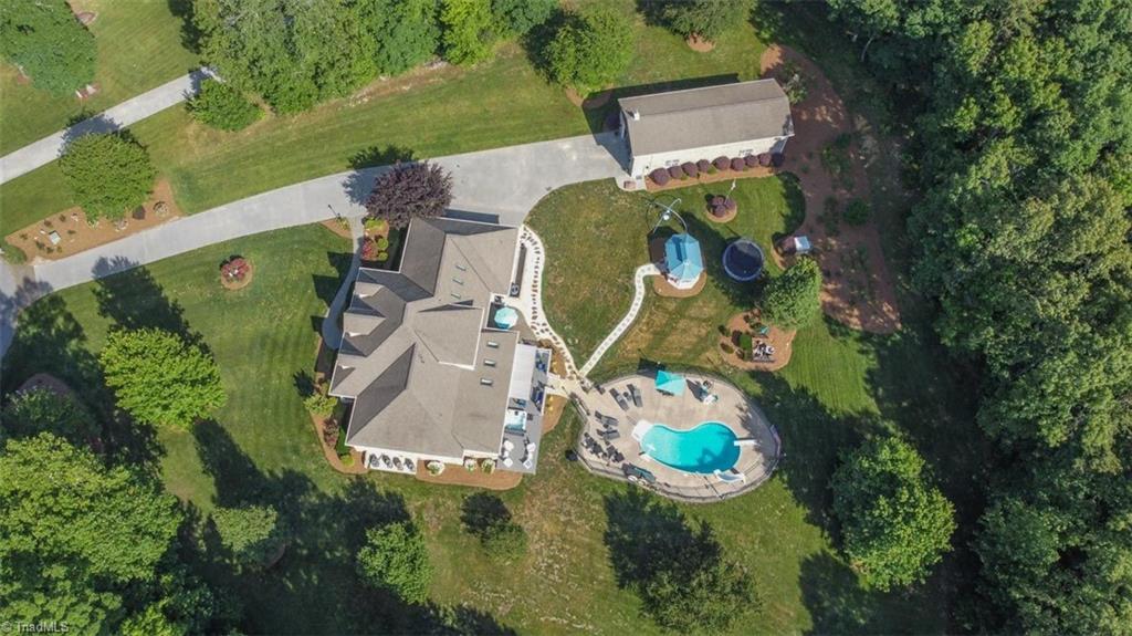 1638 Sapling Way Randleman, NC 27317 - Photo 2 of 47 This Custom built home is a rare find! Nestled on over 3 acres, this home boasts wooded privacy yet situated in a quiet neighborhood. Gorgeous salt water Pool and Huge RV Storage!