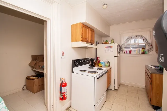 a kitchen with stainless steel appliances a sink a stove and a refrigerator