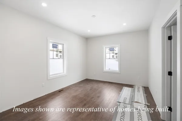 a view of an empty room and a window