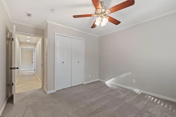 a view of a chandelier fan in a room