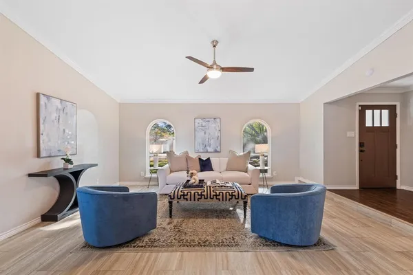a living room with furniture and a window