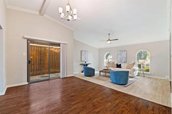 a view of a livingroom with furniture window and wooden floor