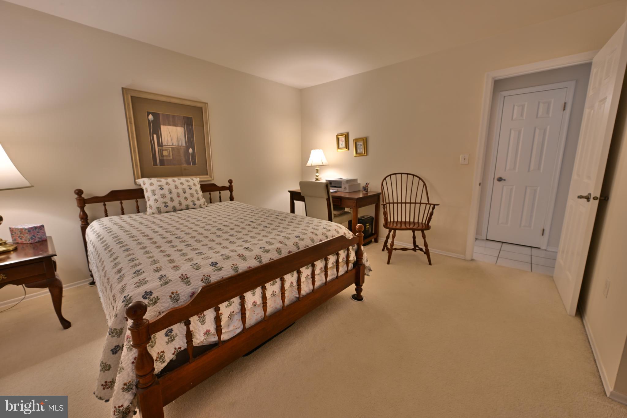 12 Windmill Court Columbus, NJ 08022 - Photo 12 of 51 a bedroom with a bed window and a table in it