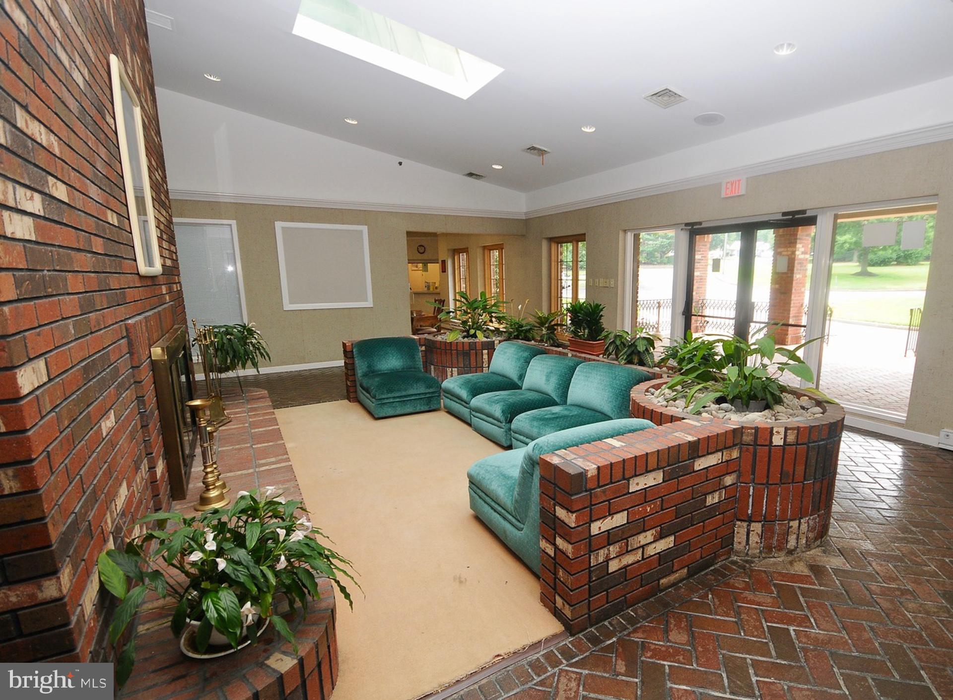 12 Windmill Court Columbus, NJ 08022 - Photo 31 of 51 a living room with furniture and a potted plant