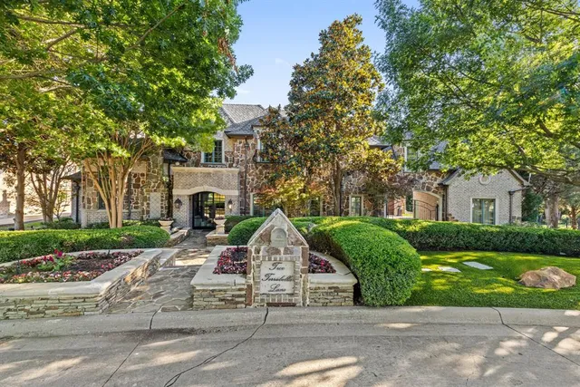 a view of a house with a garden and pathway