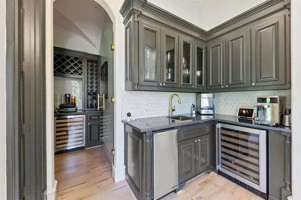 a kitchen with granite countertop a sink and cabinets