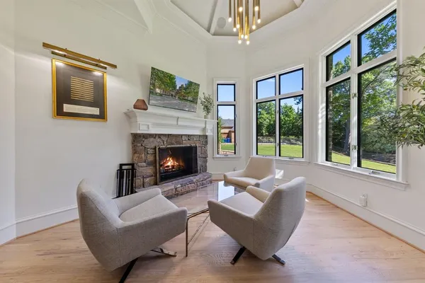 a living room with furniture and a fireplace