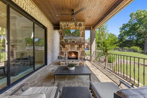 a view of a patio with a table and chairs