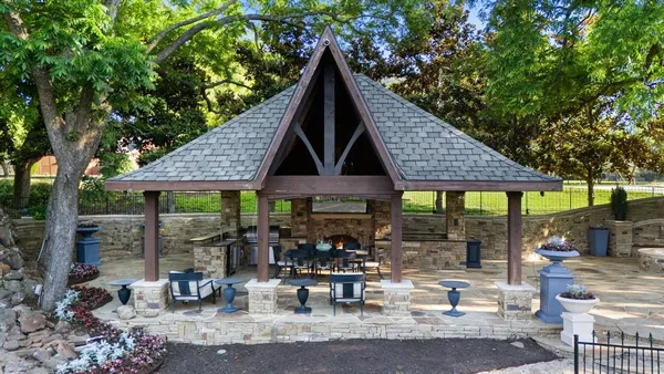 a view of a chairs and table in patio