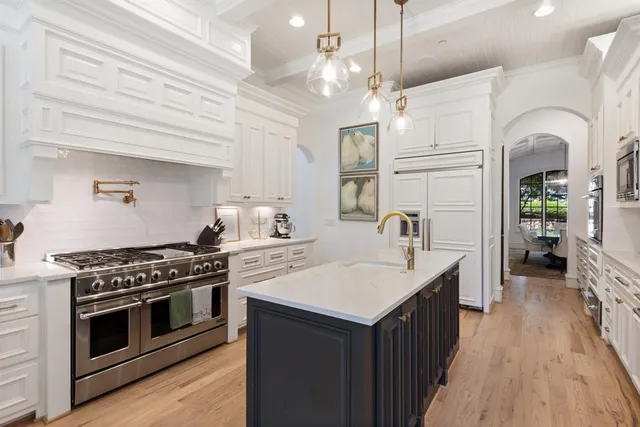 a kitchen with a stove and a sink