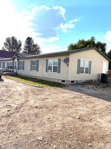 547 East 2000th Street North Vernal, UT 84078 - Photo 38 of 50 Single-story residence featuring light beige siding and a dark green shingle roof