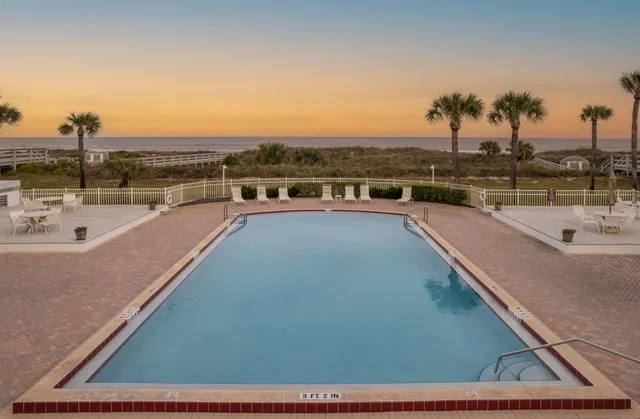 a view of hallway with wooden floor