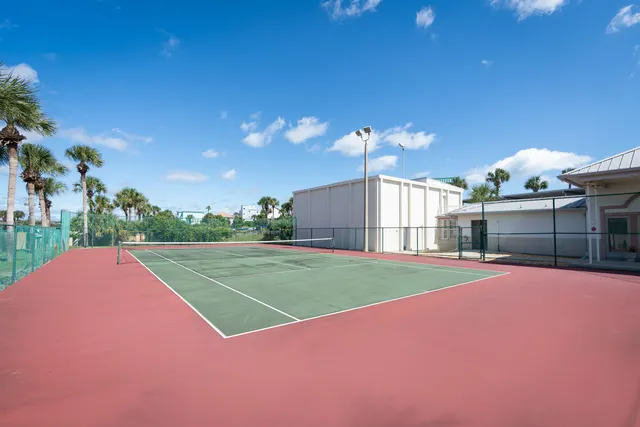a view of a swimming pool and lounge chairs