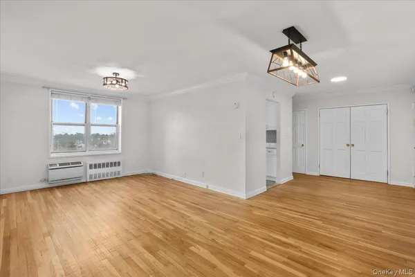 a view of an empty room with a window