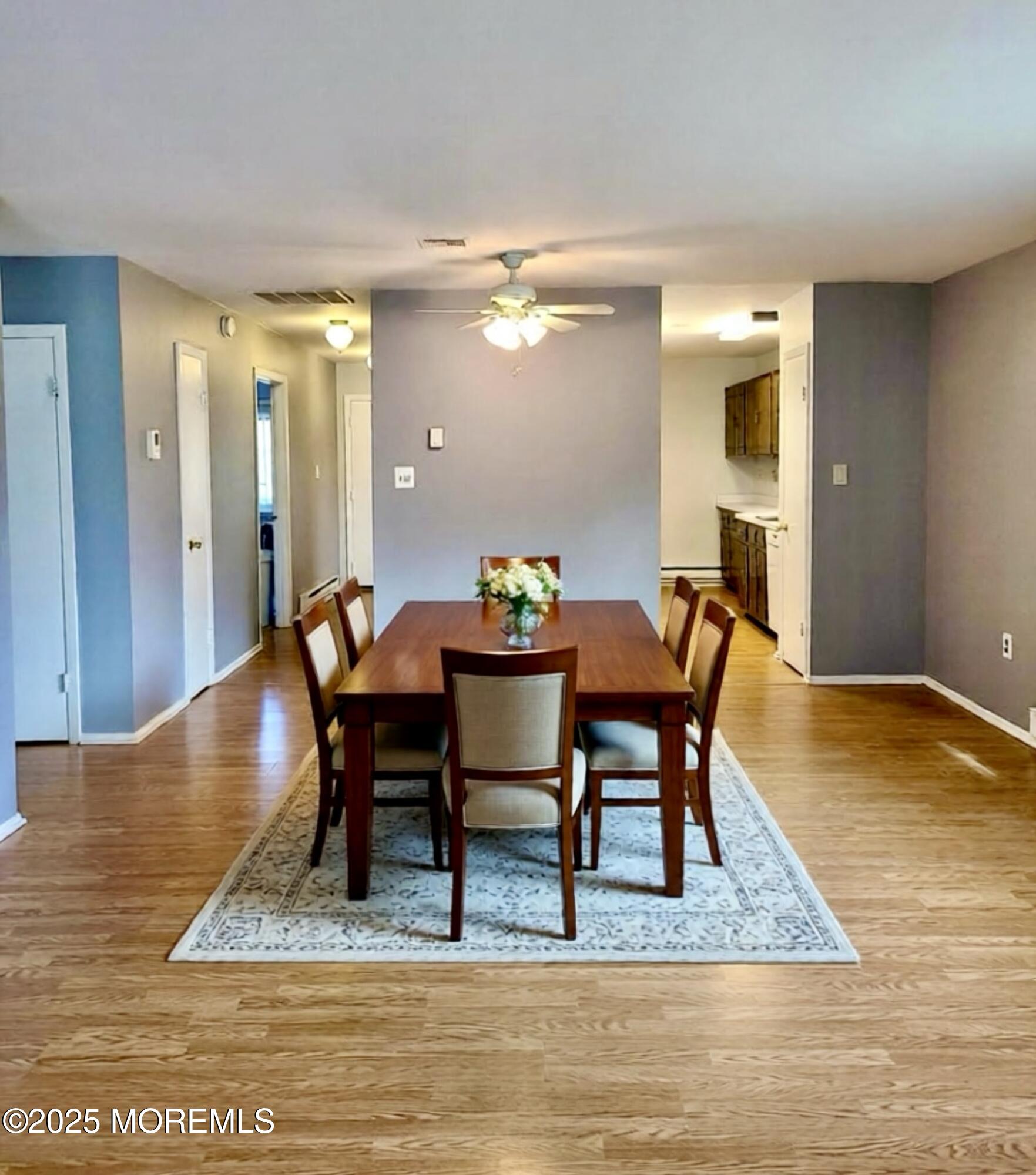 141 Cross Slope Court, Unit A Manalapan, NJ 07726 - Photo 2 of 11 a view of a dining room with furniture