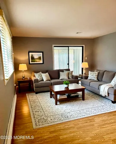 a living room with furniture and a rug