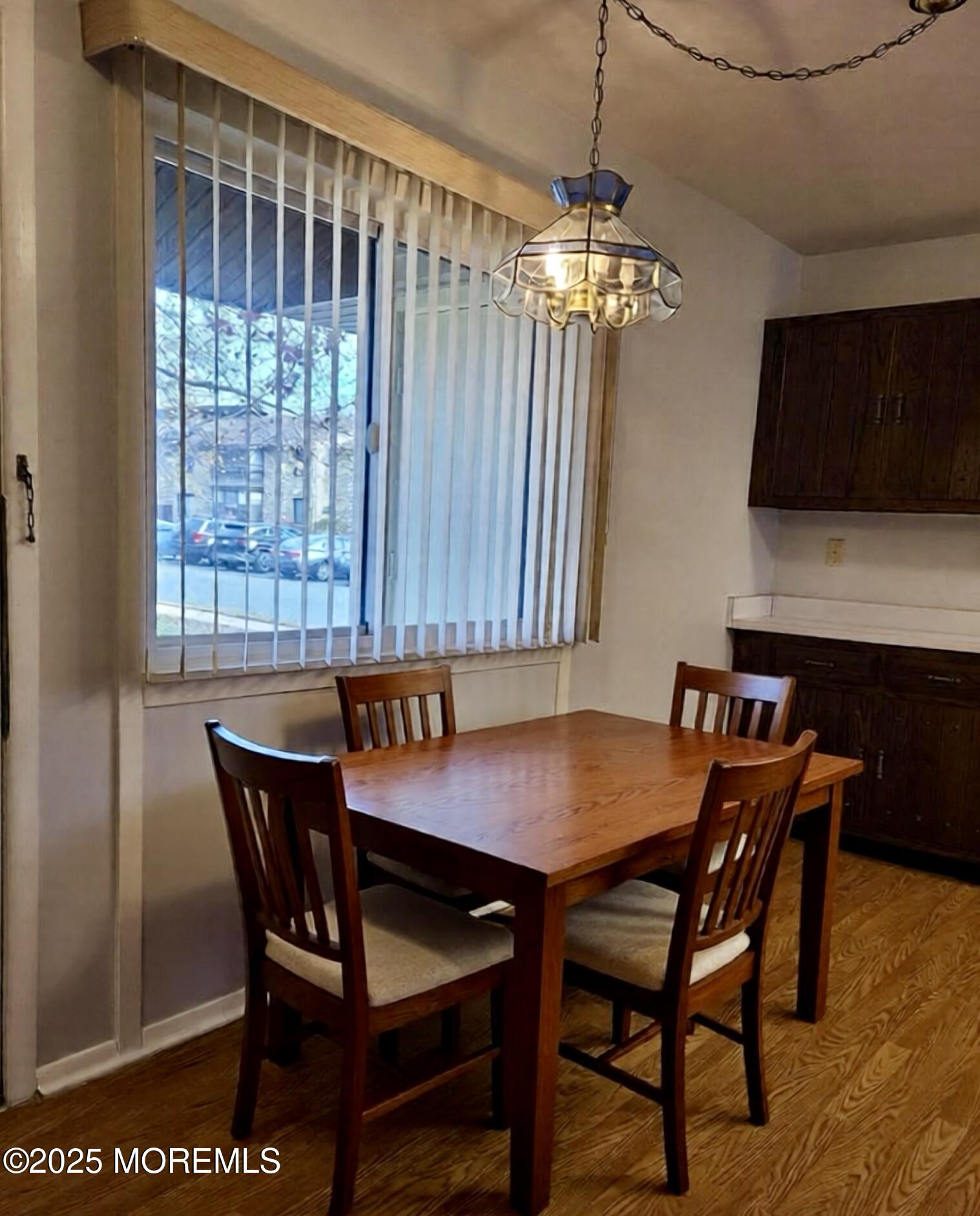 141 Cross Slope Court, Unit A Manalapan, NJ 07726 - Photo 5 of 11 a view of a dining room with furniture window and wooden floor