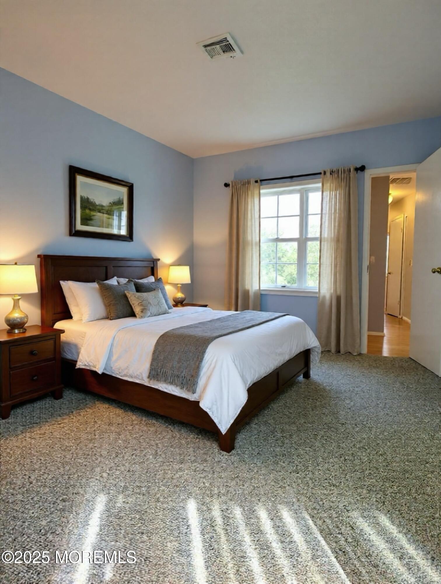 141 Cross Slope Court, Unit A Manalapan, NJ 07726 - Photo 7 of 11 a bedroom with bed and a night stand