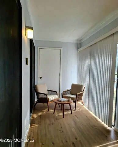 a view of a workspace with furniture and window