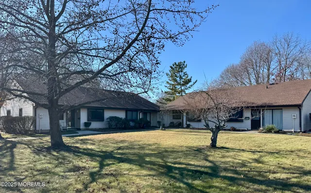 a house that has tree in front of it