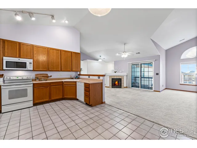 a kitchen with a sink a stove top oven and cabinets