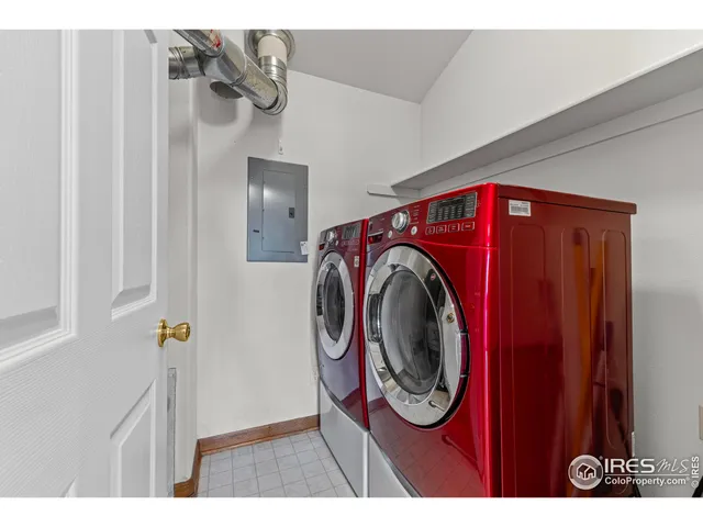 a view of a hallway with washer and dryer