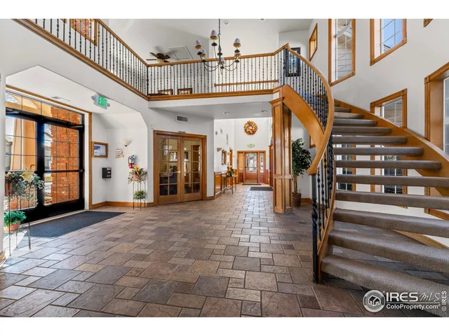 a living room with lots of furniture and gym equipment