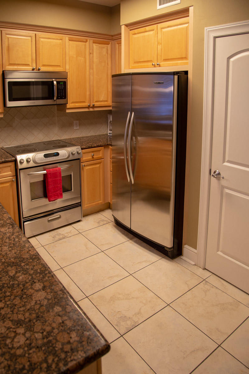 1150 Santa Rosa Boulevard, Unit 223 Fort Walton Beach, FL 32548 - Photo 11 of 35 a kitchen with a stove a microwave and a counter top space