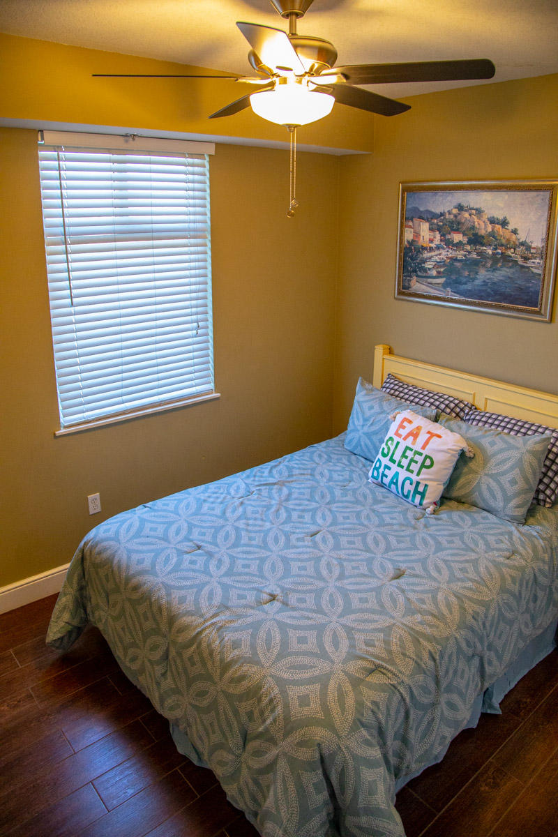 1150 Santa Rosa Boulevard, Unit 223 Fort Walton Beach, FL 32548 - Photo 19 of 35 a bedroom with a bed and a painting on the wall