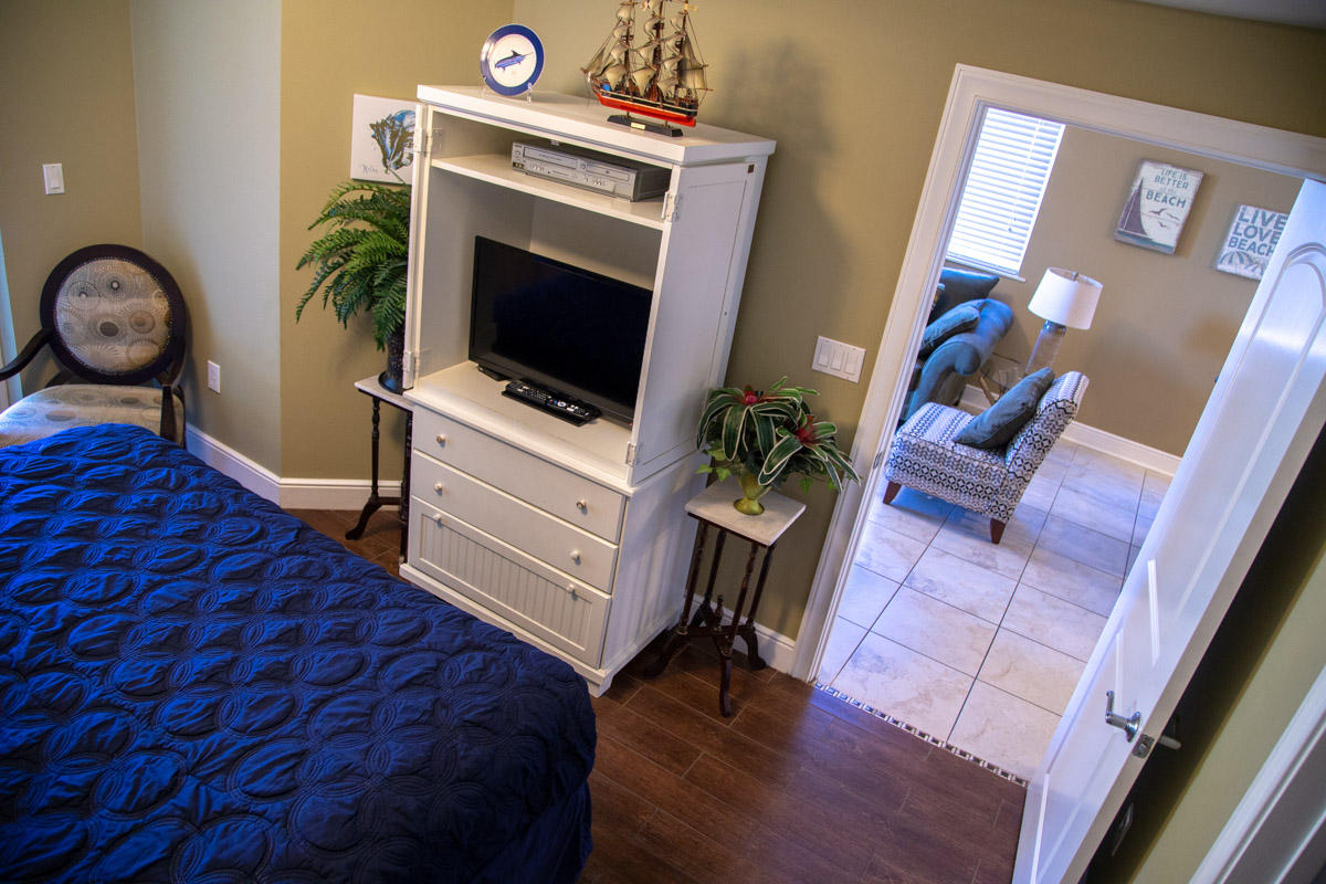 1150 Santa Rosa Boulevard, Unit 223 Fort Walton Beach, FL 32548 - Photo 23 of 35 a bedroom with a bed and a flat screen tv