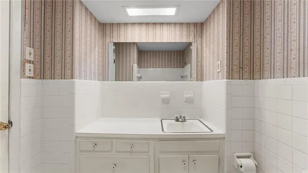 a bathroom with a sink and a mirror