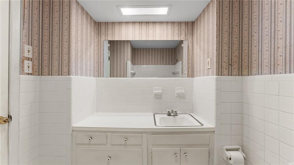 2235 Winding Way Tucker, GA 30084 - Photo 16 of 31 a bathroom with a sink and a mirror