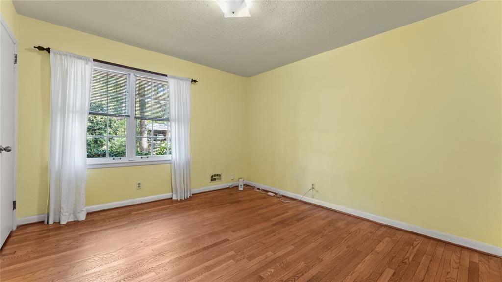 2235 Winding Way Tucker, GA 30084 - Photo 17 of 31 an empty room with wooden floor and windows